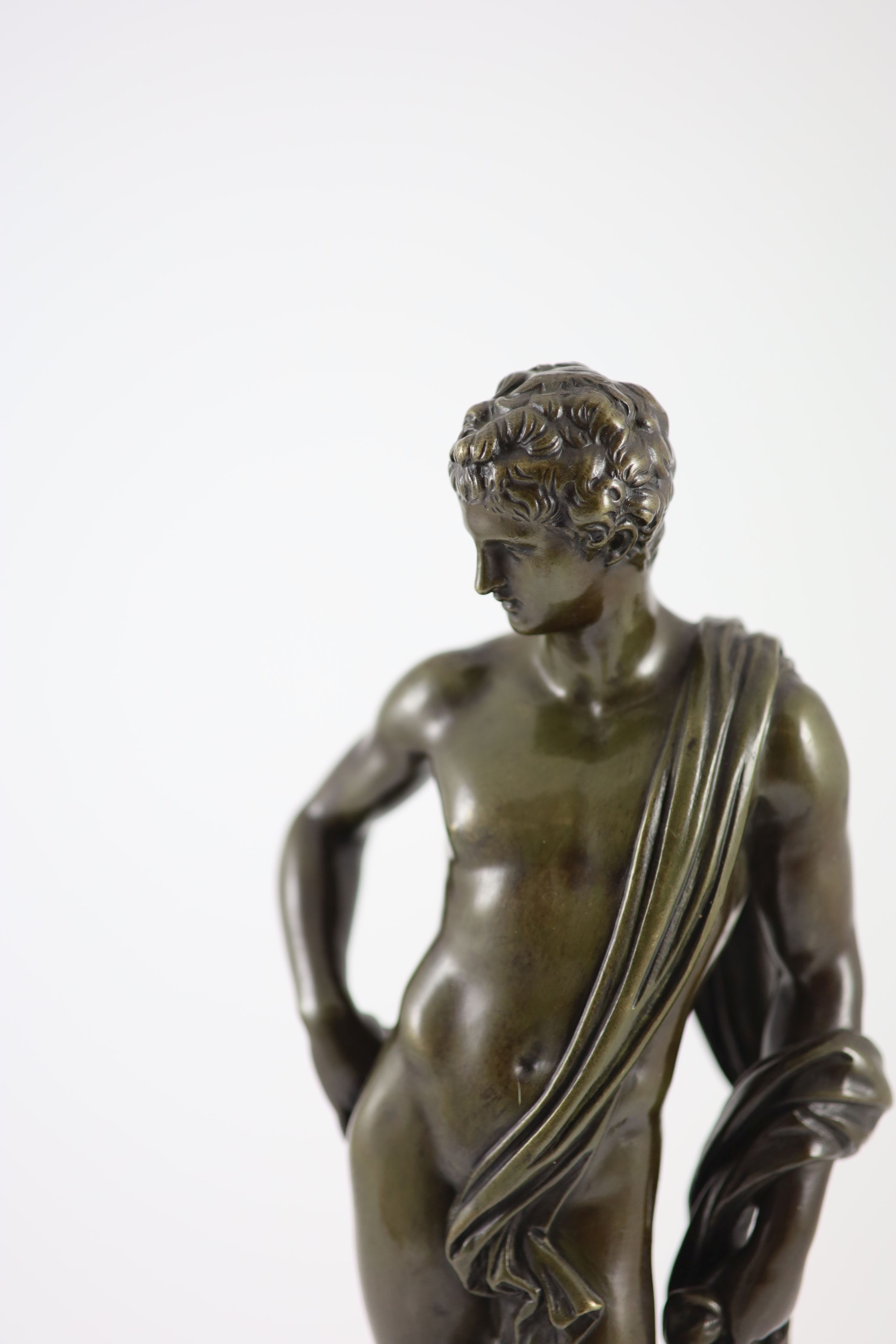 Rtion Sauvage, a bronze figure of Apollo, H 42cm. D 12cm.